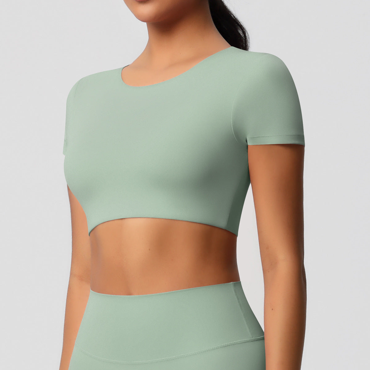 Completo Sportivo Donna – Top Schiena Lavorata e Pantaloni – Maglia manica corta 7105 – verde basilico