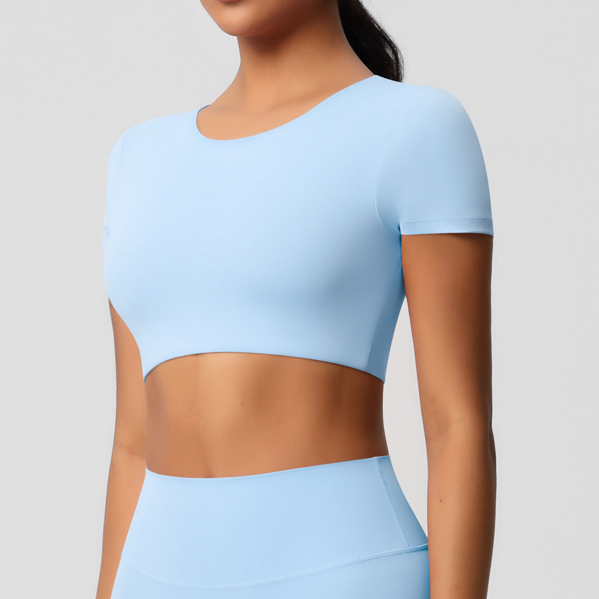 Completo Sportivo Donna – Top Schiena Lavorata e Pantaloni – Maglia manica corta 7105 – azzurro cielo