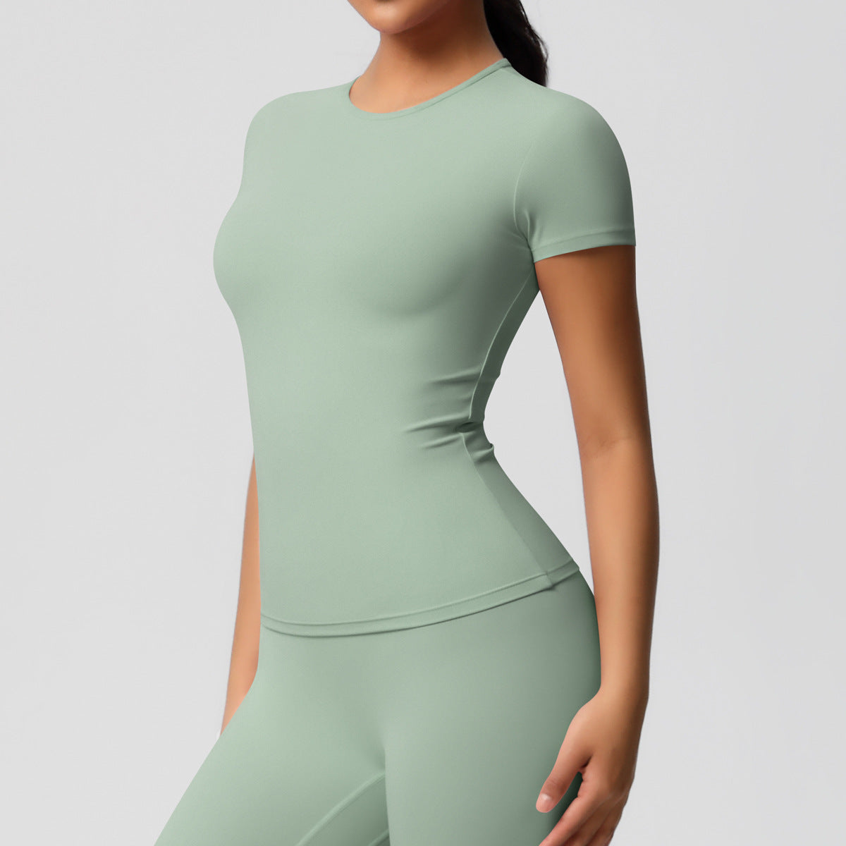 Completo Sportivo Donna – Top Schiena Lavorata e Pantaloni – Maglia manica corta 7103 – verde basilico